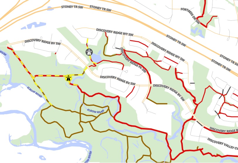 A bear spotted in the SW Calgary community of Discover y Ridge has prompted wildlife officials to close some popular hiking trails.