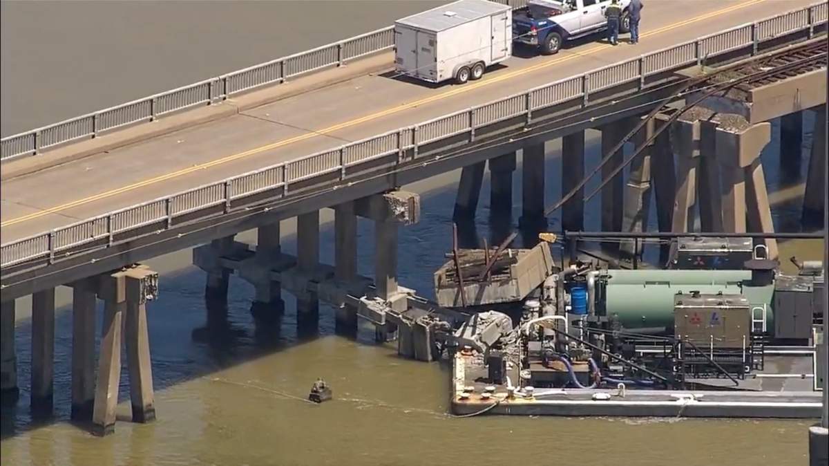 Oil spills into the surrounding waters after a barge hit a bridge in Galveston, Texas, on Wednesday, May 15, 2024. A bridge that leads to Pelican Island, located just north of Galveston, was hit by a barge around 9:30 a.m., said Ronnie Varela, with the Galveston’s Office of Emergency Management.(KTRK via AP)