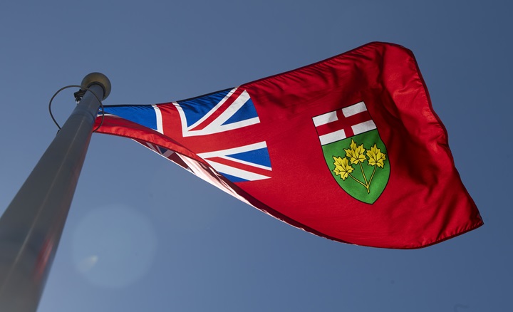The Ontario provincial flag flies in Ottawa on Monday, July 6, 2020. The Ontario government says it has reached a settlement in a treaty land entitlement claim linked to the Matachewan First Nation. Under the settlement, the First Nation located southeast of Timmins, Ont., will receive $590,000 and more than 5,000 acres of provincial Crown land, which may be added to its reserve. 