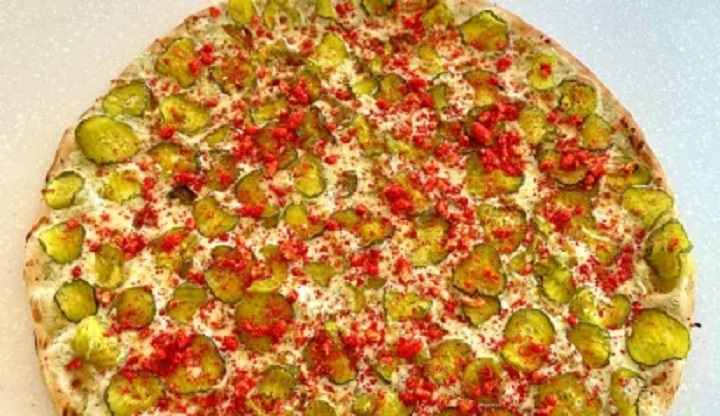 The 2024 Calgary Stampede menu includes Rick's flamin' hot Cheetos pickle pizza. 