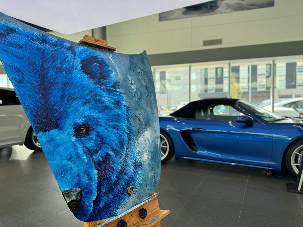 The painted Porsche hood will be raffled off on May 31, 2024.