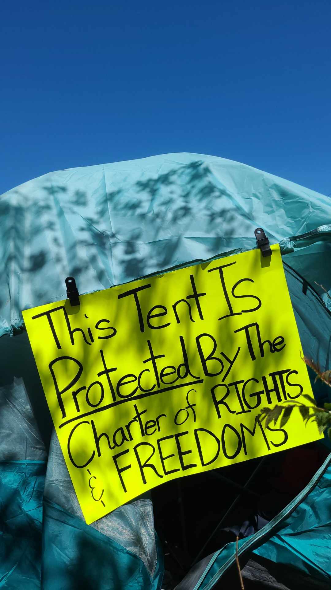 Sign at Milligan’s Park homeless encampment in Barrie, Ont.