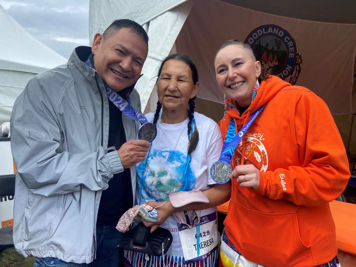 Lance Scout, Theresa Campiou, and Emilea Karhioo-Saadeh take part in running events at the Servus Calgary Marathon on Sunday  .