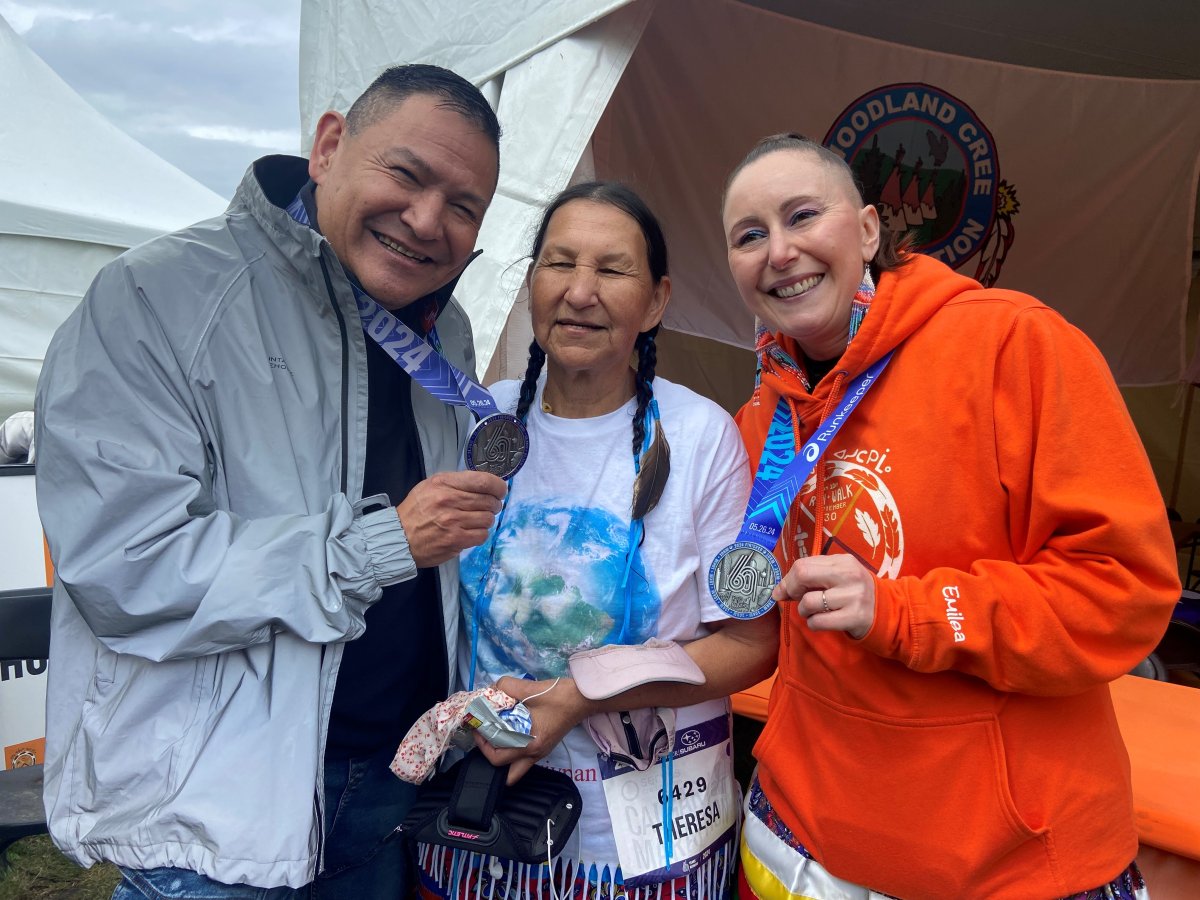Lance Scout, Theresa Campiou, and Emilea Karhioo-Saadeh take part in running events at the Servus Calgary Marathon on Sunday  .