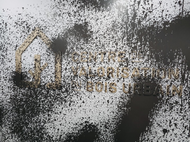 Brown paint splattered on a wall.