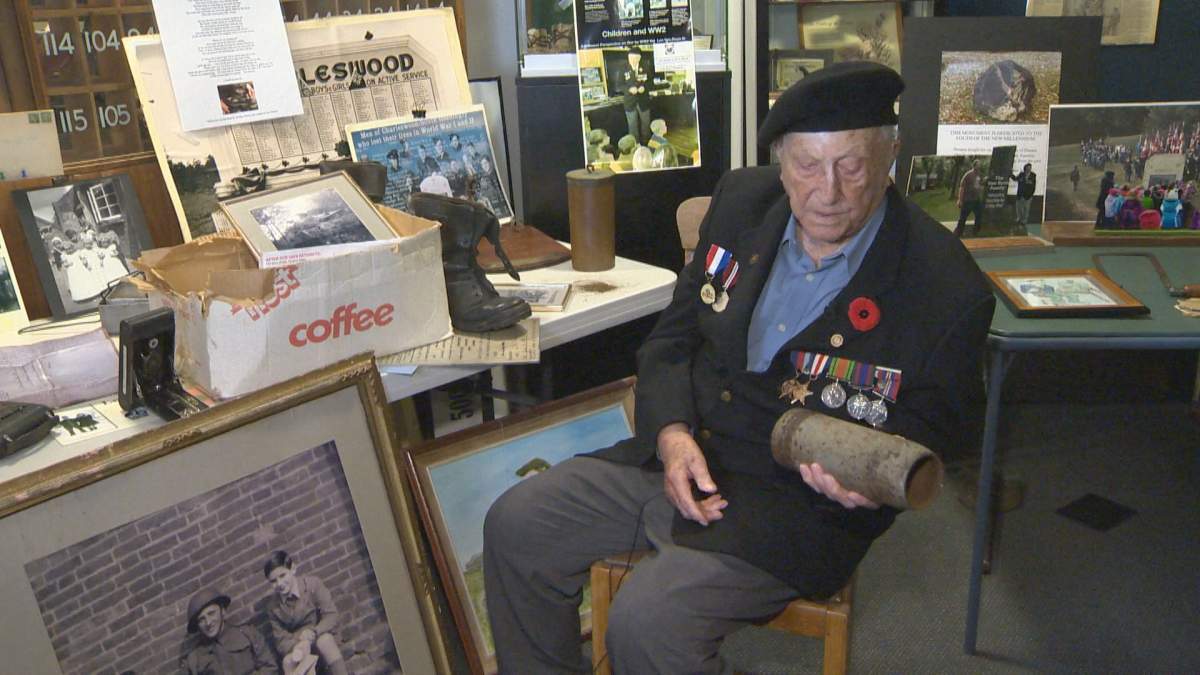 Van Roon showing some relics he has kept since the Second World War, including shell casings and the boots he wore on the shores of Juno Beach on D-Day, June 6, 1944.