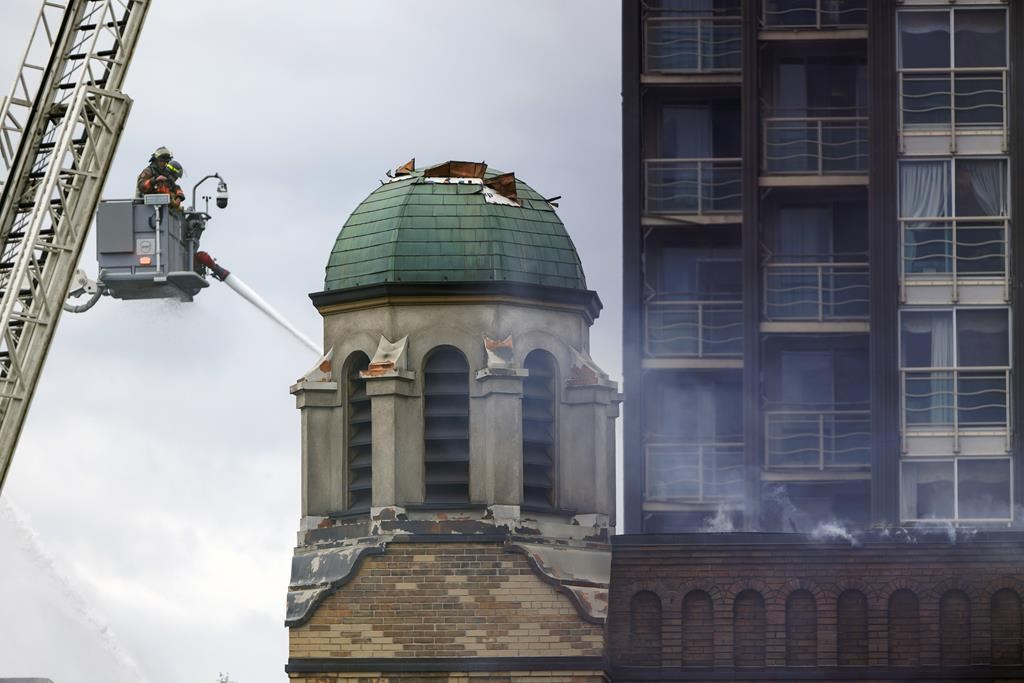 Firefighters work to put out a blaze at St. Anne’s Anglican Church in Toronto’s west end on June 9, 2024.