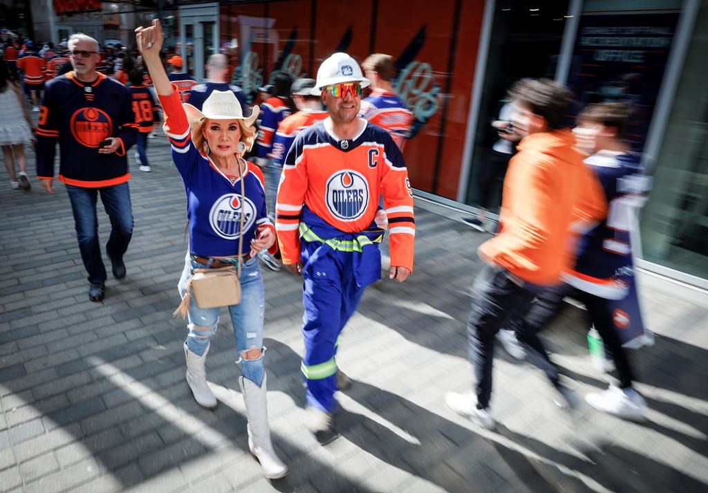 Edmonton Oilers fans arrive for Game 6 of the NHL hockey Stanley Cup final against the Florida Panthers in Edmonton, Friday, June 21, 2024.