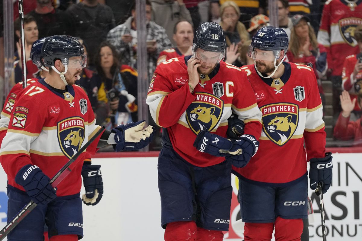 Florida Panthers centre Aleksander Barkov (16) is assisted by teammates after he was injured during the third period of Game 2 of the NHL hockey Stanley Cup Finals against the Edmonton Oilers, Monday, June 10, 2024, in Sunrise, Fla.