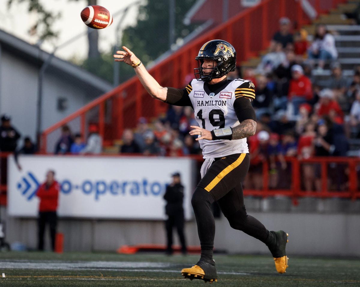 Hamilton Tiger-Cats quarterback Bo Levi Mitchell (19) throws the ball during second half CFL football action against the Calgary Stampeders in Calgary, Friday, June 7, 2024.