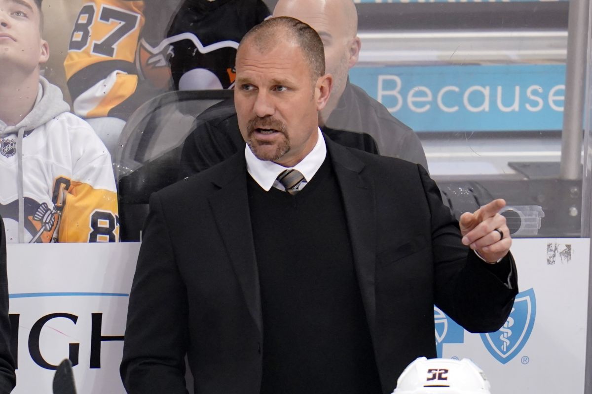 Columbus Blue Jackets head coach Brad Larsen gives instructions during the first period of an NHL hockey game against the Pittsburgh Penguins in Pittsburgh, Friday, April 29, 2022.