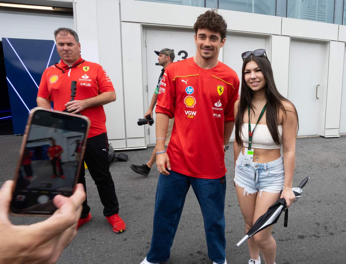 Ferrari driver Charles Leclerc poses for a photo with a fan at the Canadian Grand Prix Thursday, June 6, 2024 in Montreal.