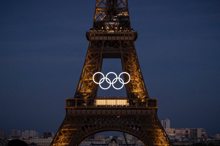 Olympic rings mounted to Eiffel Tower, marking 50 days until Paris games