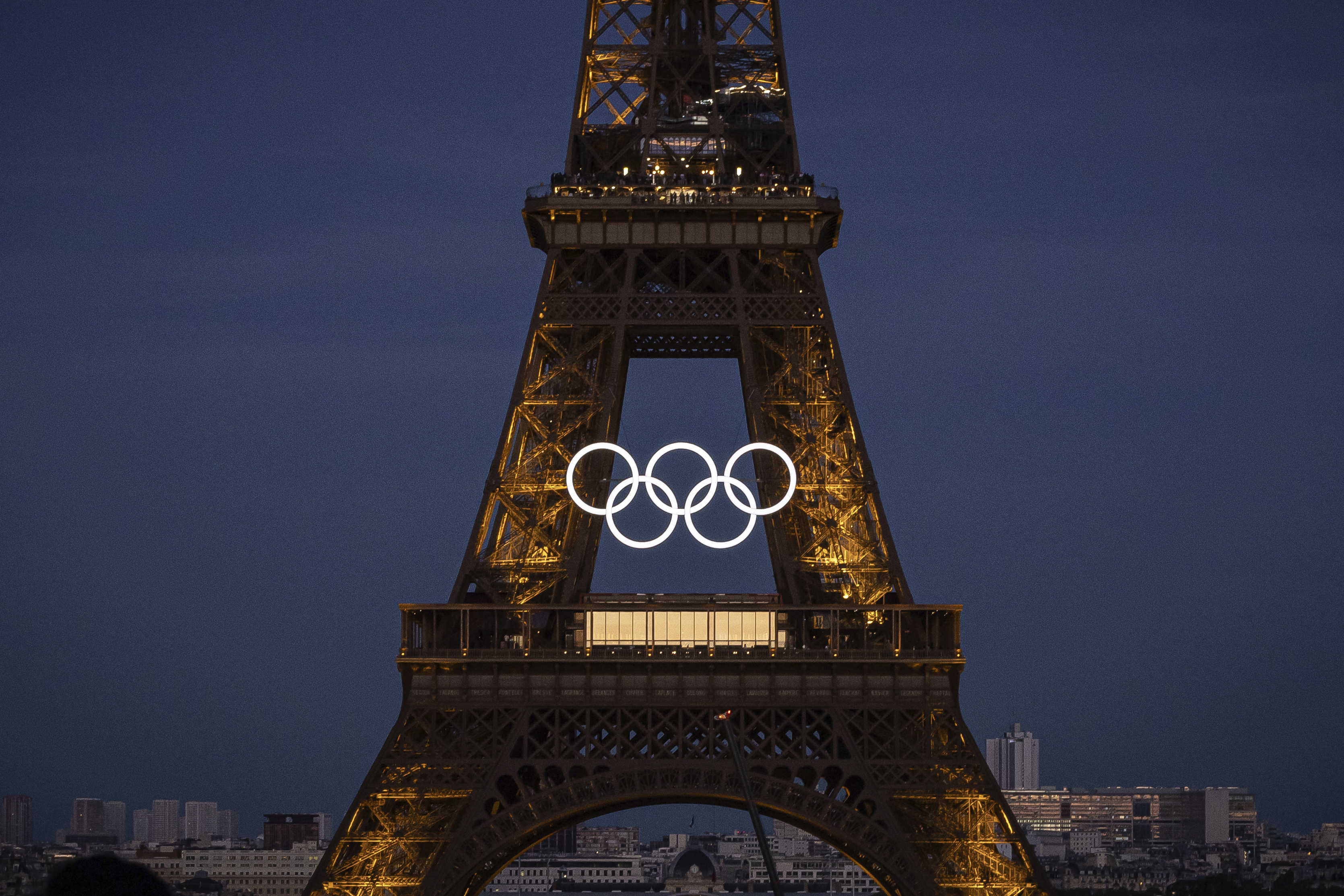 Olympic rings mounted to Eiffel Tower, marking 50 days until Paris games