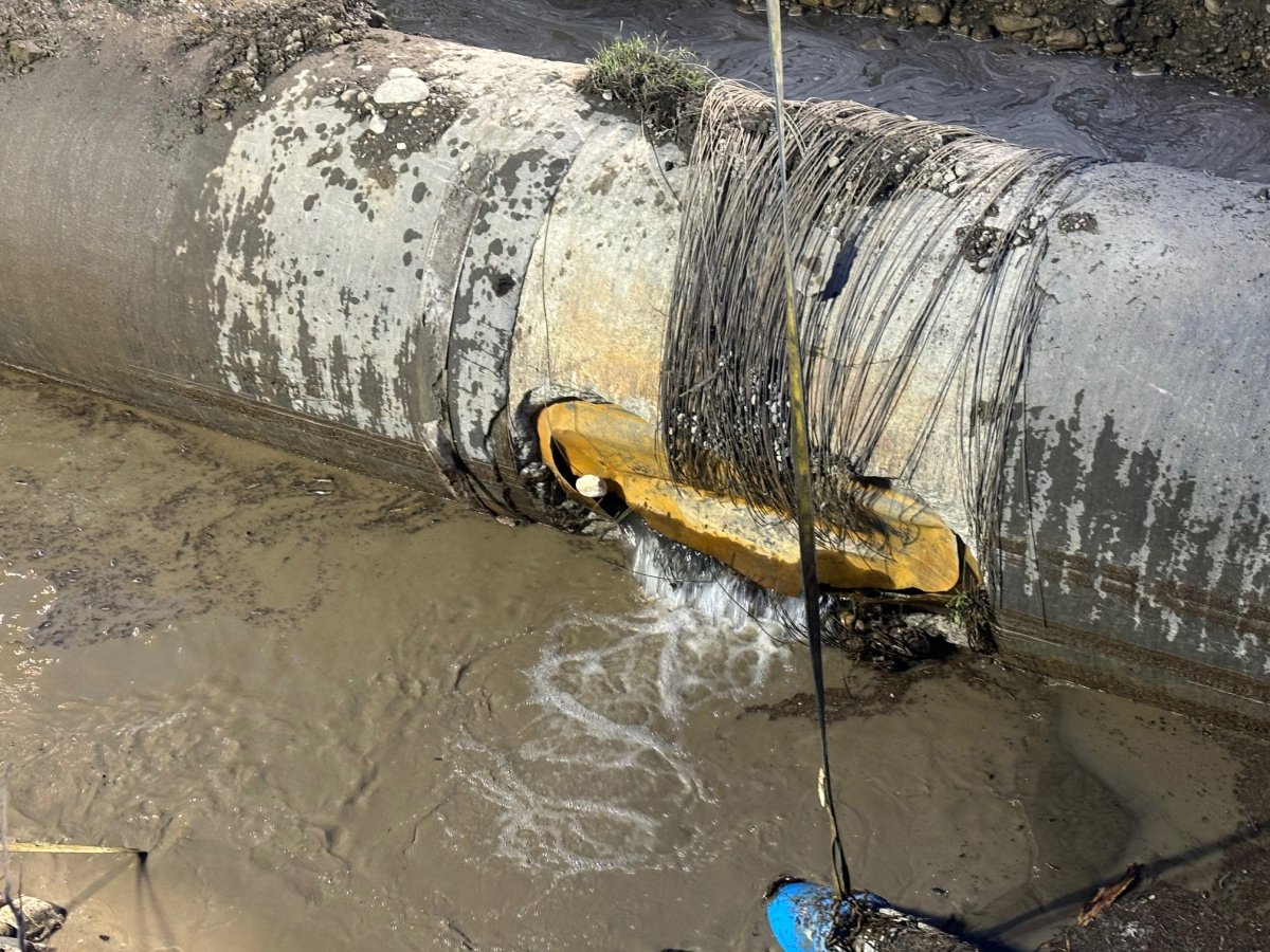 The damaged section of a water pipe is shown in this handout image provided by the City of Calgary.