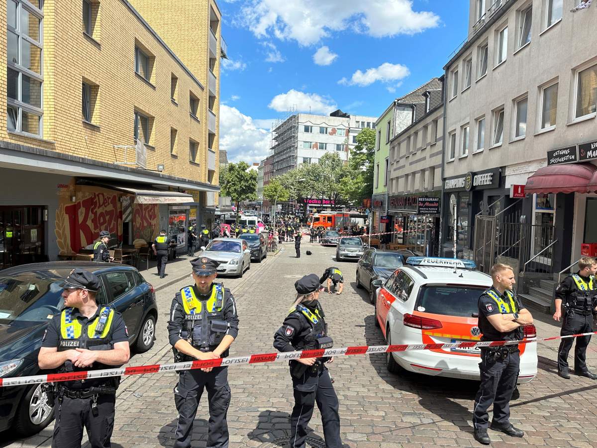 Police cordon off an area near the Reeperbahn in Hamburg, Germany, Sunday, June 16, 2024. German police say officers have shot and wounded a man who was threatening them with an axe and a firebomb in the northern city of Hamburg, hours before the city hosts a match in the Euro 2024 soccer tournament.