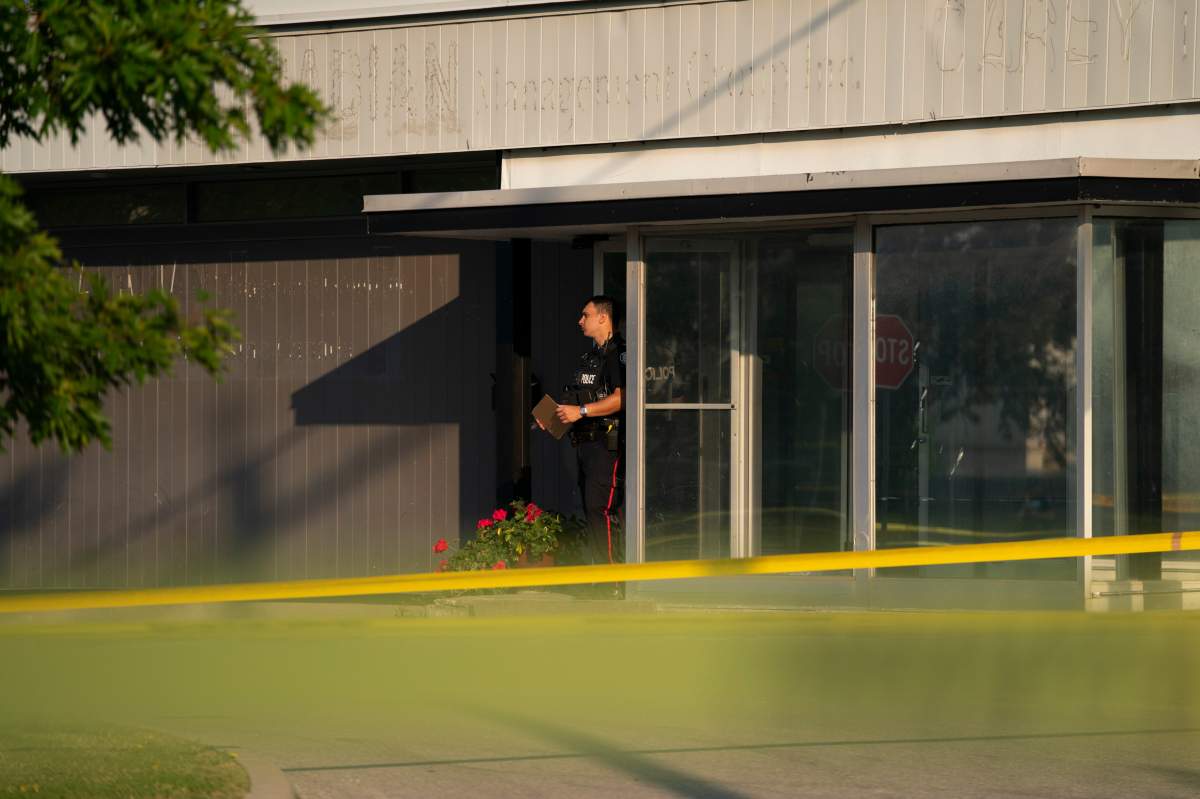 Toronto police officers investigate reports of gunshots, in Toronto, Monday, June 17, 2024.