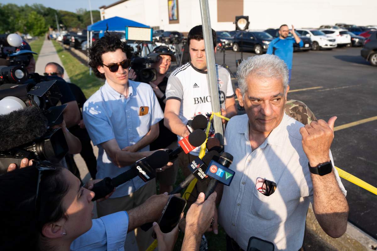 Shahrokh Biniyaz, who has a studio in a building where a shooting left three people dead, speaks to media, in Toronto, Monday, June 17, 2024.