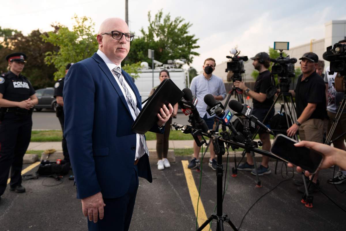 Detective Sergeant Alan Bartlett of Homicide and Missing Persons Unit speaks to media at the scene of a shooting that left three people dead in Toronto, Monday, June 17, 2024.