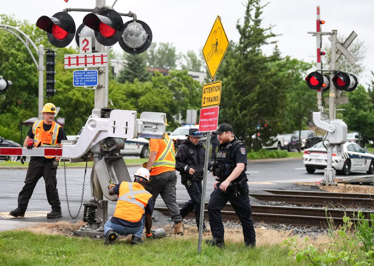 CN workers check their equipment in St. Bruno, Que., Saturday, June 29, 2024. A police spokesperson stated that a group of approximately 30 pro-Palestinian protesters blocked the railway leading to two arrests for mischief and obstruction.
