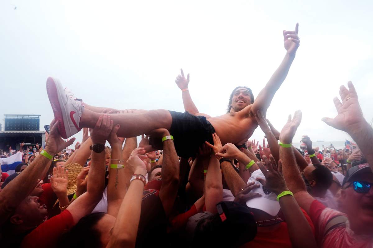 Florida Panthers' Ryan Lomberg is carried off by fans during an NHL hockey parade and rally to celebrate the team's Stanley Cup win against the Edmonton Oilers, Sunday, June 30, 2024, in Fort Lauderdale, Fla.