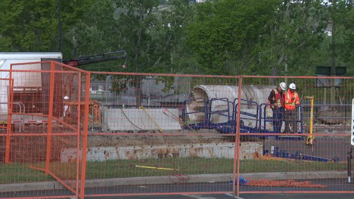 Crews in Calgary work on a water main break on June 10, 2024.