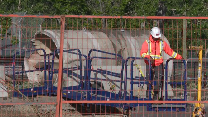 Crews in Calgary work on a water main break on June 10, 2024.