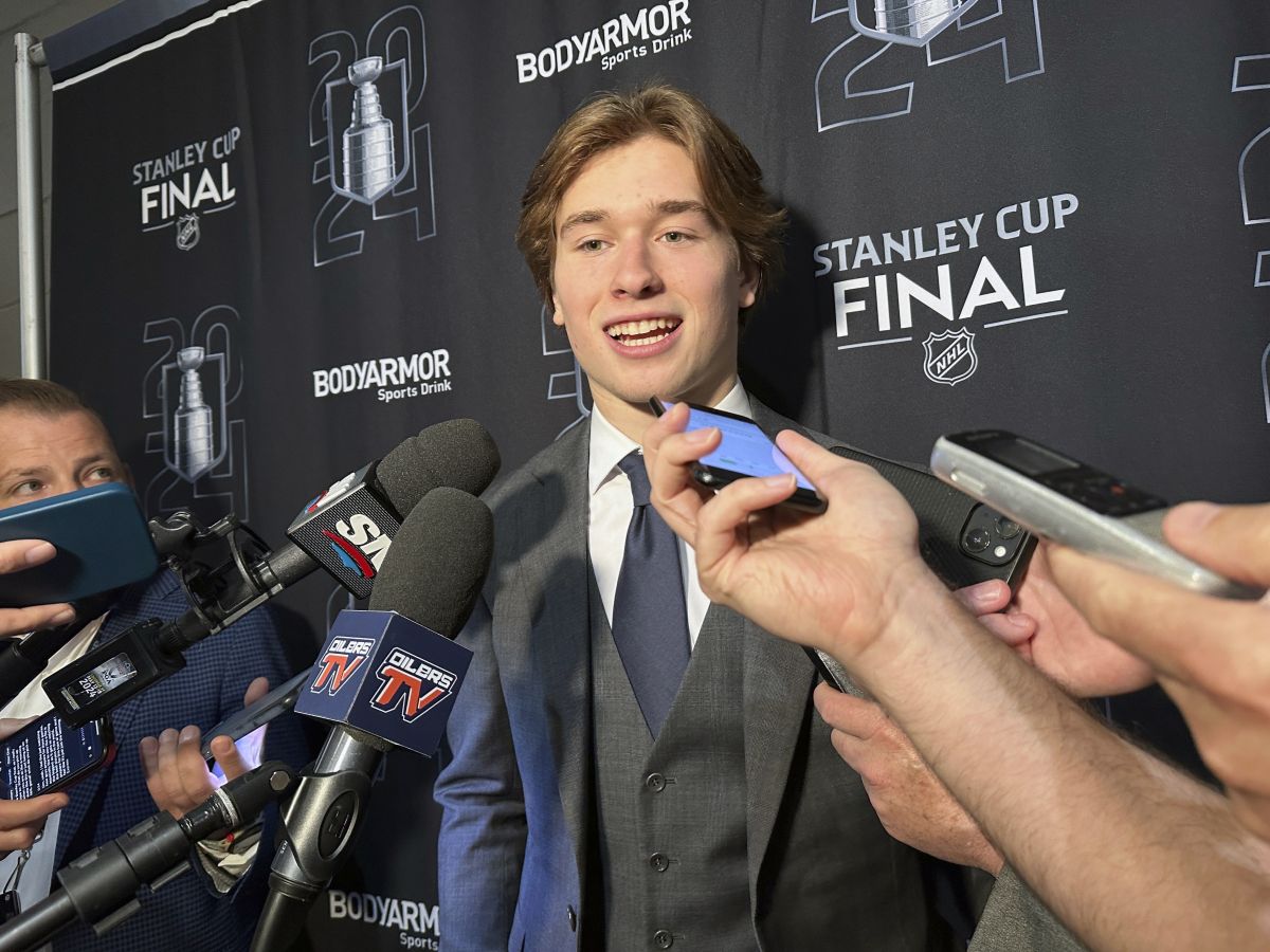 Macklin Celebrini, the expected No. 1 pick in the NHL draft to the San Jose Sharks, speaks with reporters prior to Game 2 of the Stanley Cup Final at Amerant Bank Arena in Sunrise, Florida, Monday, June 10, 2024.