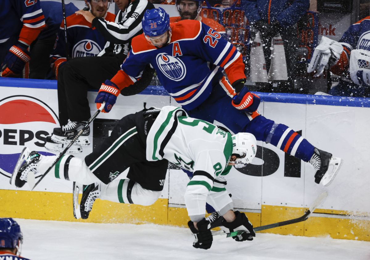 Dallas Stars forward Matt Duchene (95) is checked by Edmonton Oilers defenceman Darnell Nurse (25) during first period of Game 6 of the Western Conference finals of the NHL hockey Stanley Cup playoffs in Edmonton, Sunday, June 2, 2024.