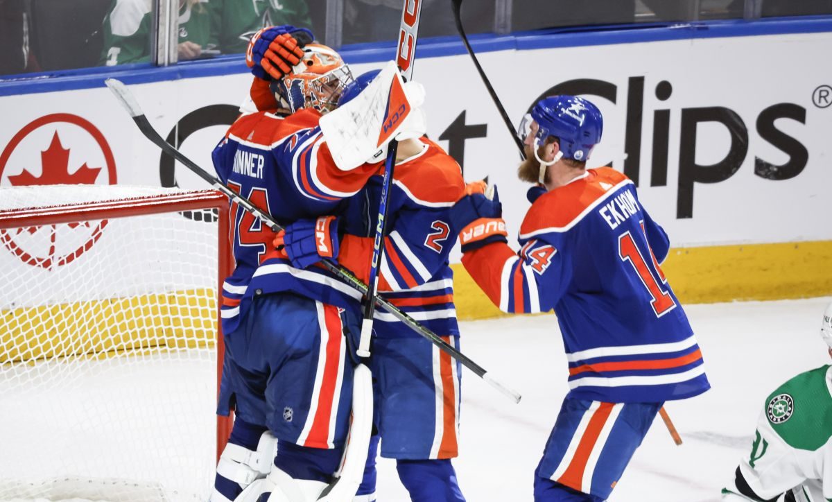 Edmonton Oilers goalie Stuart Skinner (74) celebrates with defenceman Evan Bouchard (2) and defenceman Mattias Ekholm (14) after defeating the Dallas Stars in Game 6 of the Western Conference finals of the NHL hockey Stanley Cup playoffs in Edmonton, Sunday, June 2, 2024.