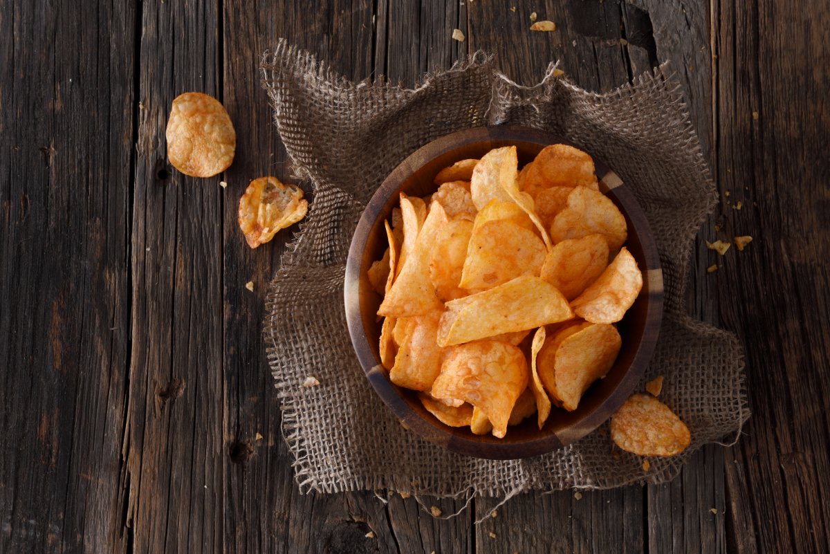 Barbecue flavor potato chips in a wooden bowl