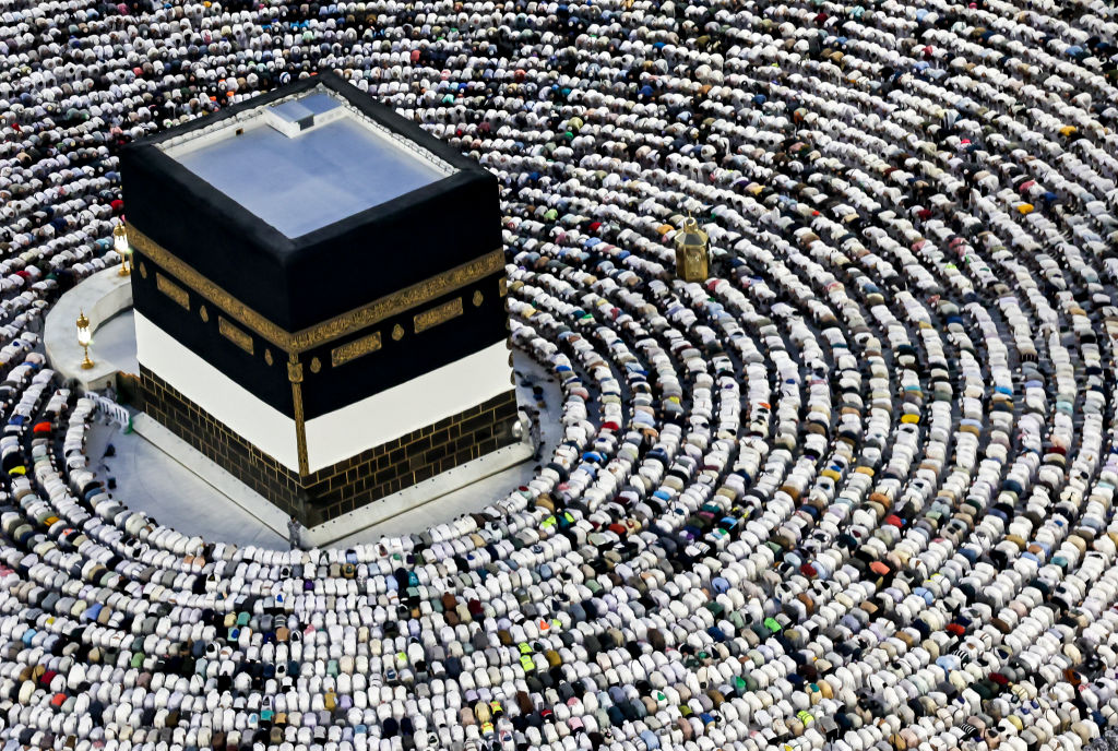 Muslim pilgrims pray around the Kaaba, Islam's holiest shrine, at the Grand Mosque in the holy city of Mecca on June 16, 2024, as they perform the farewell circumambulation or "tawaf", circling seven times around the large black cube, which is the focal point on the final day of the hajj.