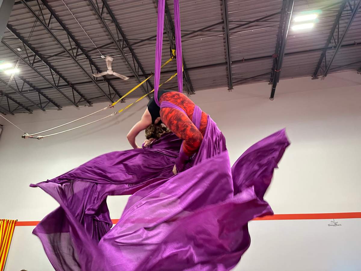 Taija Graham practicing her aerial silk act before performing at the Alberta Circus Arts Festival.