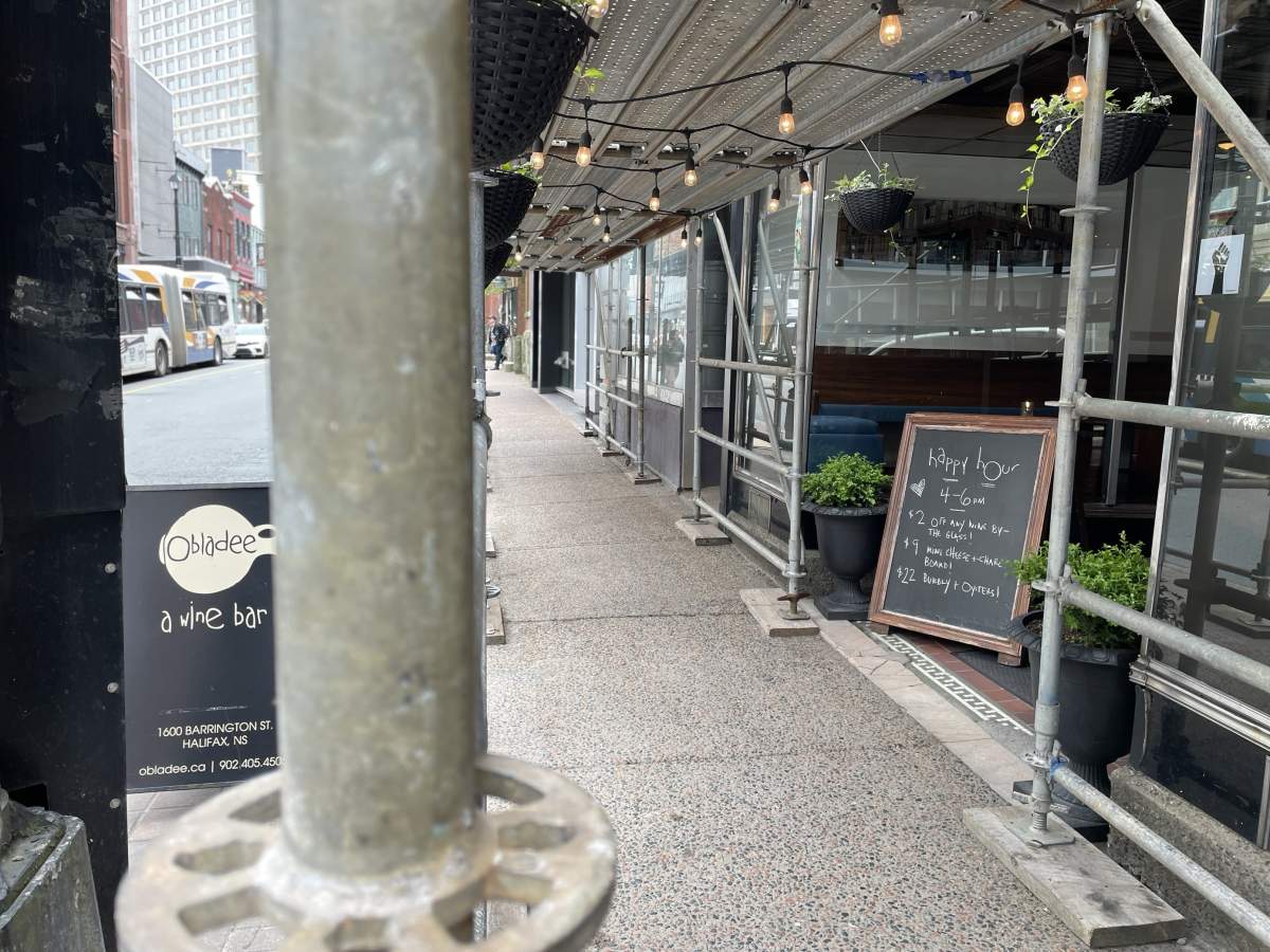 Lights hang around scaffolding located at the entrance of Oladee’s wine bar in downtown Halifax.