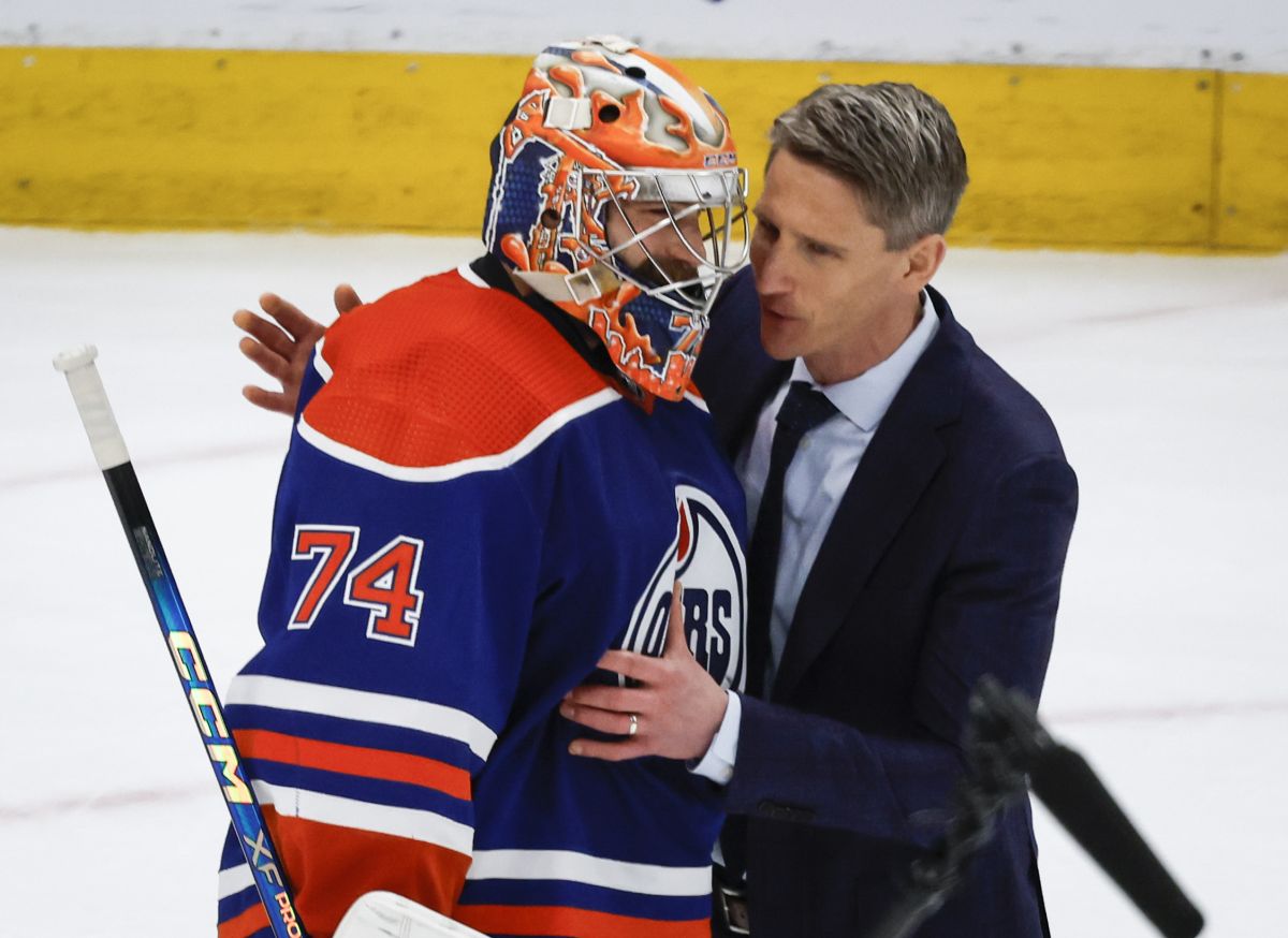 Edmonton Oilers goalie Stuart Skinner (74) is congratulated by head coach Kris Knoblauch after defeating the Dallas Stars in Game 6 of the Western Conference finals of the NHL hockey Stanley Cup playoffs in Edmonton, Sunday, June 2, 2024.