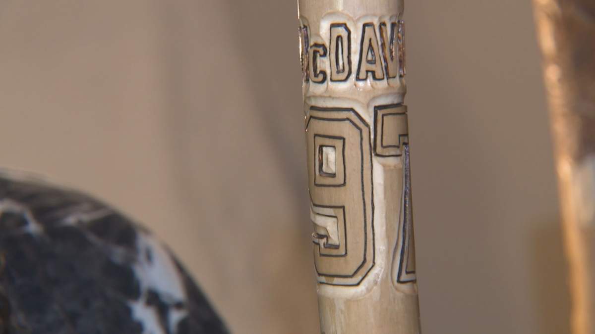 Brian Boser's relief carving walking stick for Edmonton Oilers.