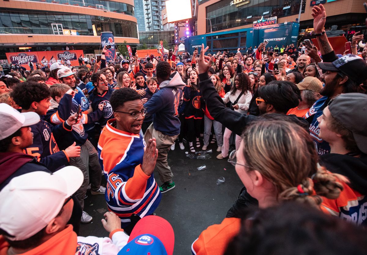 Oilers fans celebrate after the Edmonton Oilers defeated the Florida Panthers during a watch party for Game 5 of the NHL Stanley Cup final, in Edmonton on Tuesday, June 18, 2024.