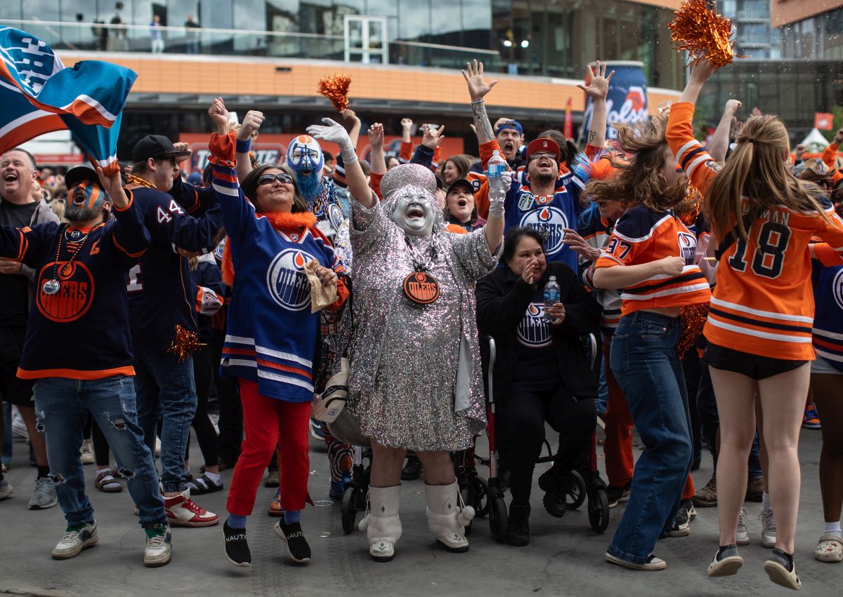 Oilers fans cheers as they watch the Edmonton Oilers score a goal against the Florida Panthers during a watch party for Game 5 of the NHL Stanley Cup final, in Edmonton on Tuesday, June 18, 2024.