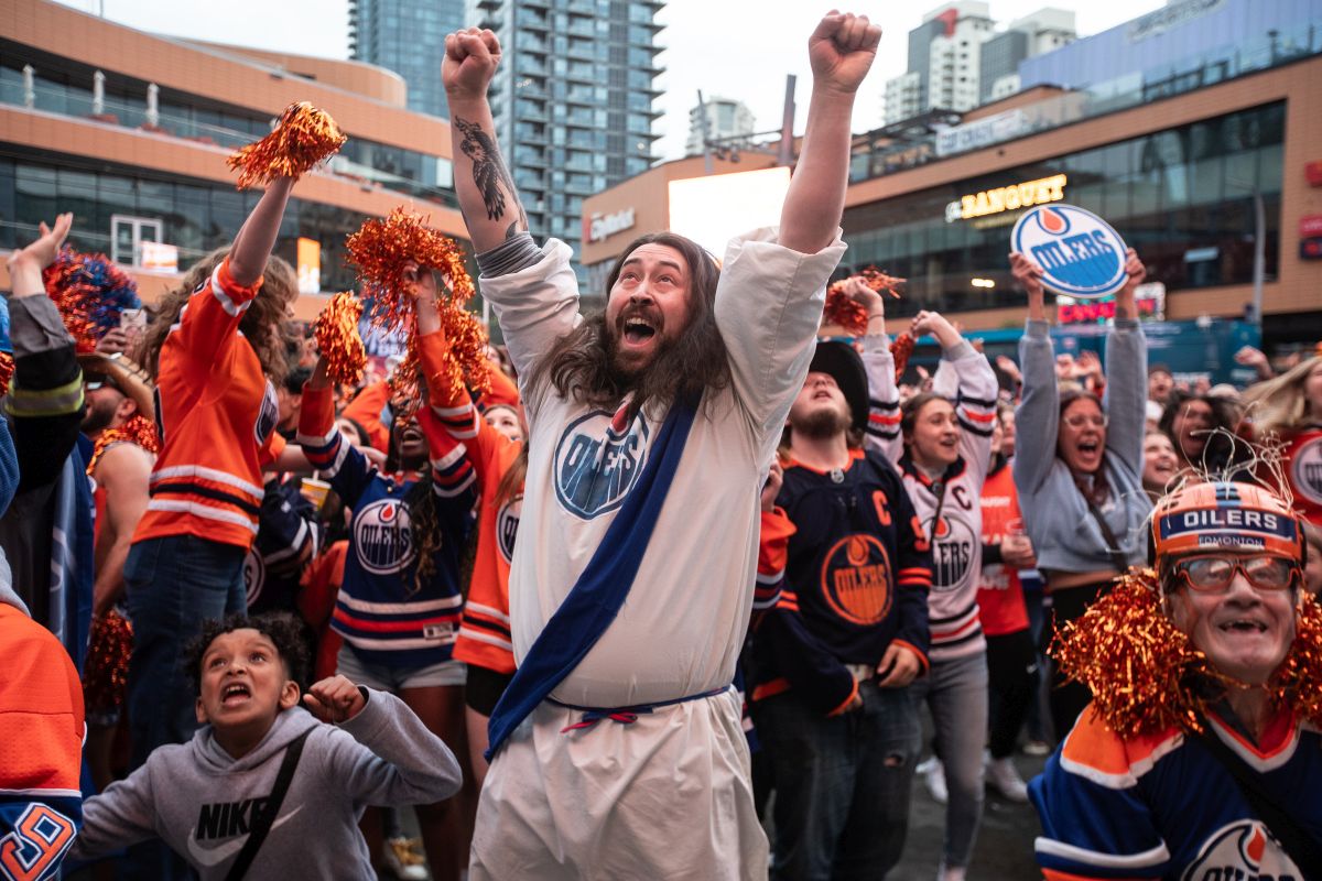 Oilers fans celebrate as the Edmonton Oilers defeat the Florida Panthers during a watch party for Game 5 of the NHL Stanley Cup final, in Edmonton on Tuesday, June 18, 2024.