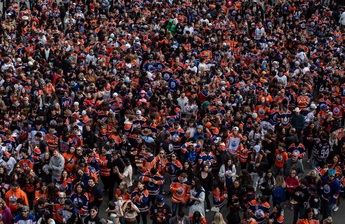 Hockey fans watch on a big screen as the Edmonton Oilers take on the Florida Panthers during a watch party for Game 5 of the NHL Stanley Cup final, in Edmonton on Tuesday, June 18, 2024.