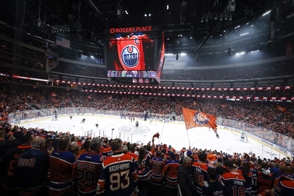 Edmonton Oilers fans cheers their team before the start of first period of Game 6 of the Western Conference finals against the Dallas Stars in the NHL hockey Stanley Cup playoffs in Edmonton, Sunday, June 2, 2024.