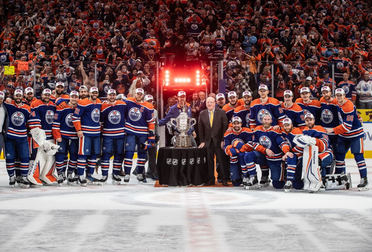 Edmonton Oilers stand with the Campbell Conference Bowl after beating the Dallas Stars in game 6 of the Western Conference finals of the NHL Stanley Cup playoffs in Edmonton on Sunday June 2, 2024.
