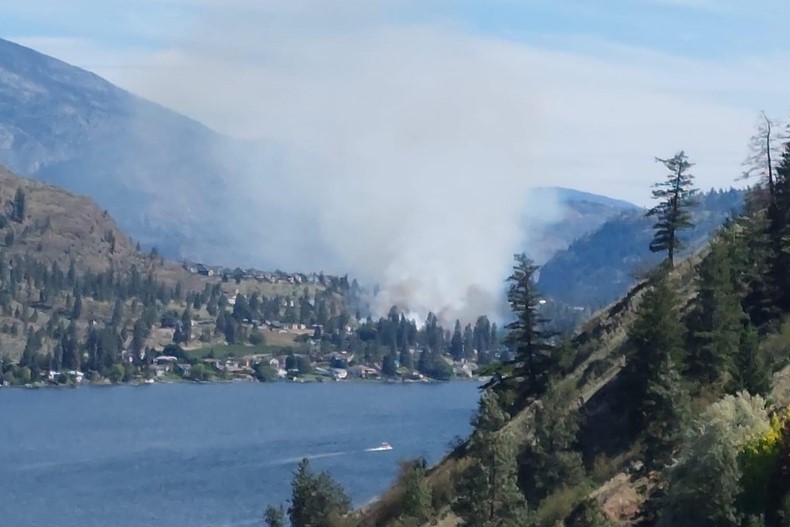 Smoke rises from the fire in Okanagan Falls on Saturday, June 8, 2024.