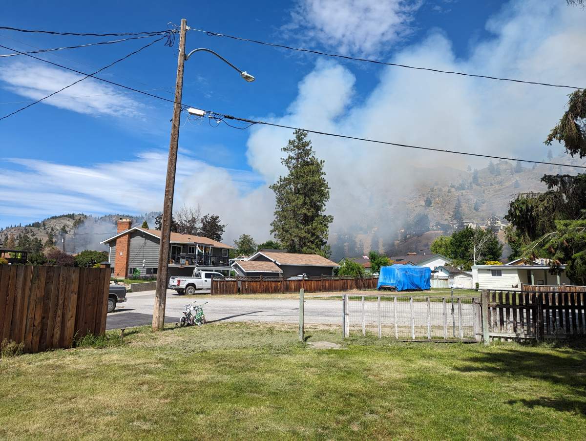 Smoke rises from the fire in Okanagan Falls on Saturday, June 8, 2024.