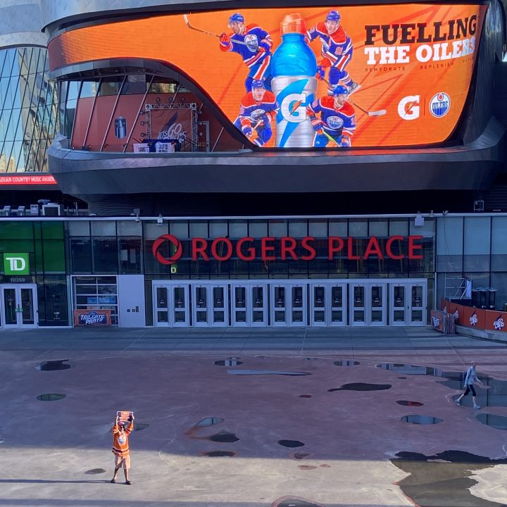 Early Monday morning, an Oilers fan is seen outside Rogers Place in Edmonton as the team is in Florida to play Game 7 of the Stanley Cup Final against the Panthers.