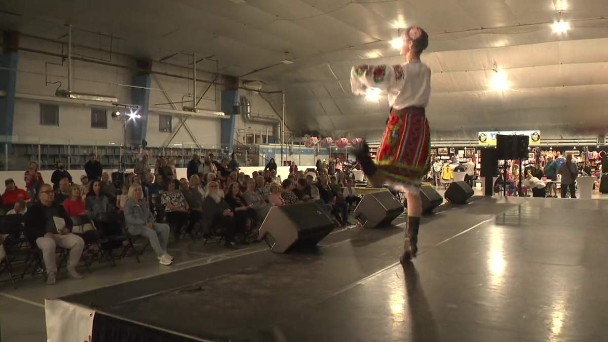 A dancer performs in front of a large crowd at the Calgary Ukrainian Festival, June 2, 2024,