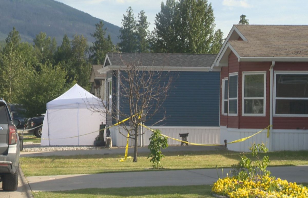 Police tape in front of a mobile home in Sicamous, B.C.
