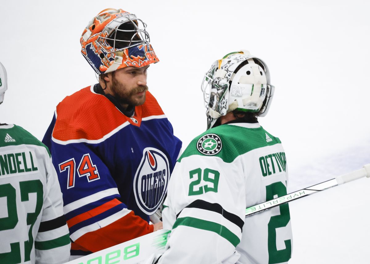 Edmonton Oilers goalie Stuart Skinner (74) and Dallas Stars goalie Jake Oettinger (29) shake hands following Game 6 of the Western Conference finals of the NHL hockey Stanley Cup playoffs in Edmonton, Sunday, June 2, 2024.