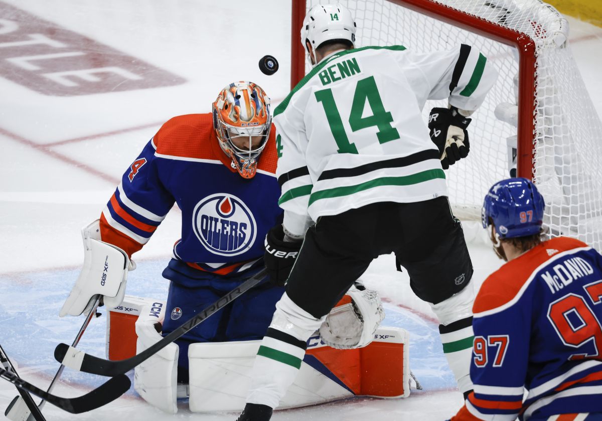 Dallas Stars forward Jamie Benn (14) has his shot deflected by Edmonton Oilers goalie Stuart Skinner (74) during second period of Game 6 of the Western Conference finals of the NHL hockey Stanley Cup playoffs in Edmonton, Sunday, June 2, 2024.