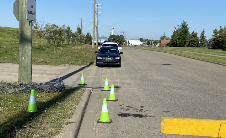 A spike belt is seen at 56th Avenue in Leduc, Alta., on June 20, 2024 as police investigate an undisclosed incident.